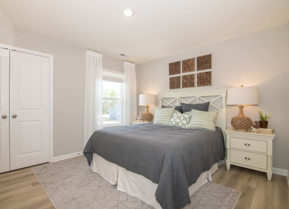 a bedroom with a bed and a closet at Jackson Run Townhomes, Indiana, 46075