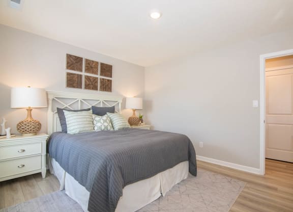 a bedroom with a bed and a closet at Jackson Run Townhomes, Whitestown
