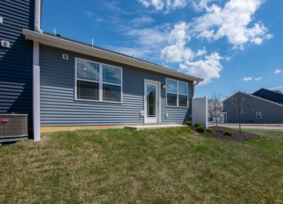 an image of a building with clouds in the sky at Jackson Run Townhomes, Whitestown