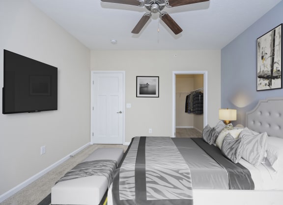 Bedroom with bed and a ceiling fan at Monmouth Row Apartments, Kentucky, 41071
