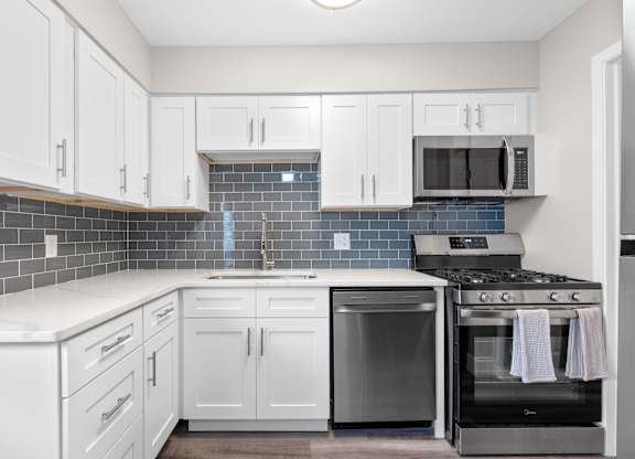 Kitchen with white cabinets at The Rand Apartments, Ohio