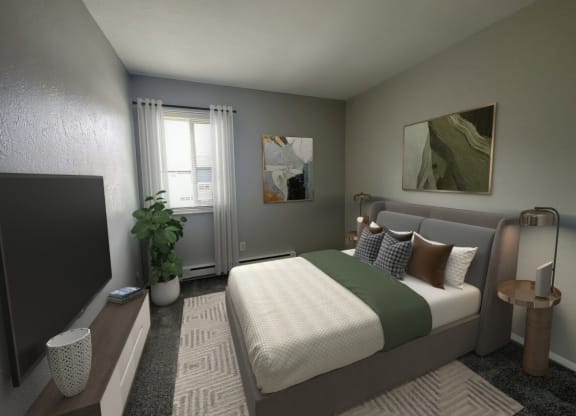 a bedroom with a bed and a tv in a room