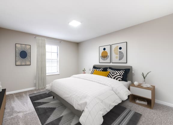 a bedroom with a large bed in front of a window with blinds
