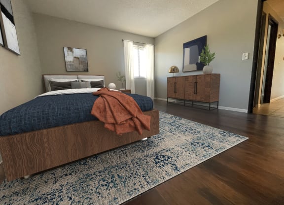 a bedroom with a bed and a dresser