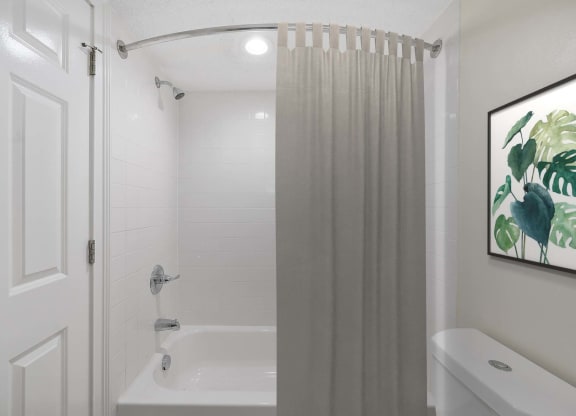 a bathroom with a shower and a toilet at Harpers Point Apartments, Cincinnati, 45249
