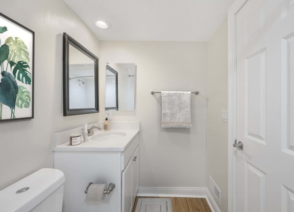 a bathroom with a sink and a mirror at Harpers Point Apartments, Cincinnati, Ohio