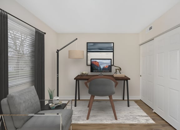 a home office with a computer desk and chair at Harpers Point Apartments, Cincinnati