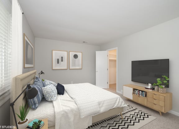 a bedroom with a bed and a tv at 7 Pointe Apartments, Indiana