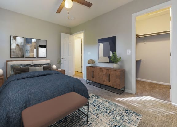 a bedroom with a large bed and a ceiling fan at Ridgeview, Fortville, Indiana