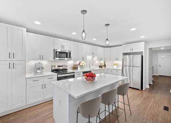 a large white kitchen with a white counter top at Indian Creek Apartments*, Cincinnati, Ohio