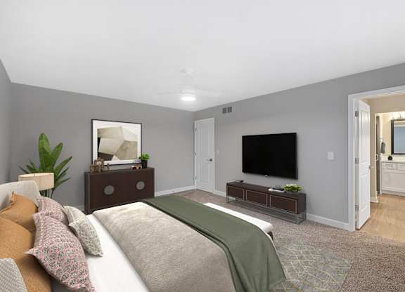 a bedroom with a large bed and a tv at Indian Creek Apartments*, Cincinnati, OH