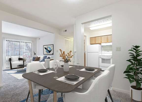 A dining room with a table set for two and a potted plant on the side table.