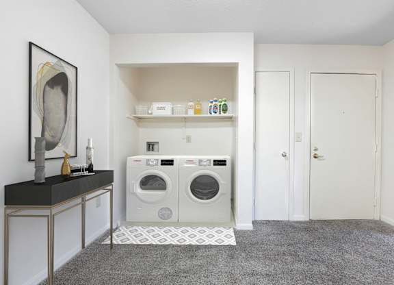 A laundry room with a washer and dryer.