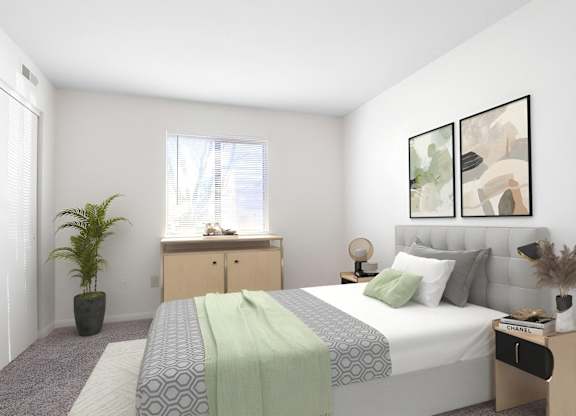 A bedroom with a bed, nightstand, and a plant.