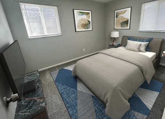 A bedroom with a bed, a television, and two pictures on the wall.