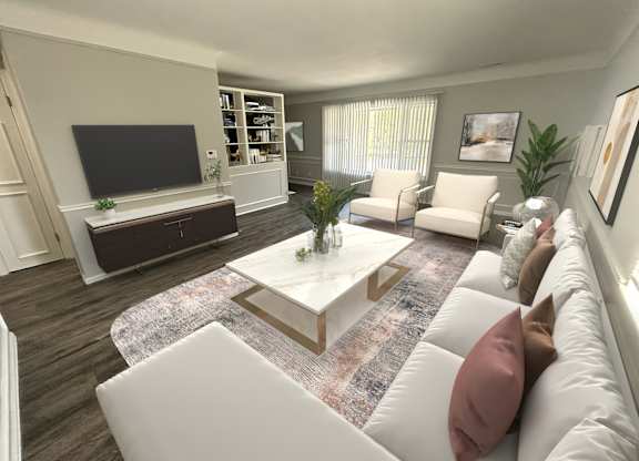 A living room with a white couch and a coffee table in the center.