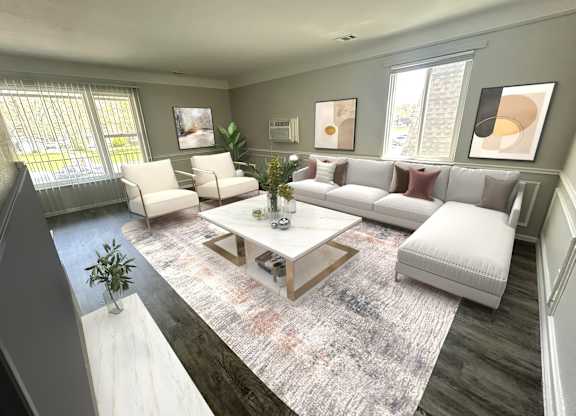 A living room with a white couch, a coffee table, and a rug.