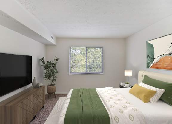A bedroom with a bed, a television, and a plant.