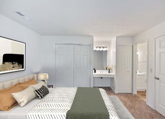 A bedroom with a bed, a nightstand, and a mirror.
