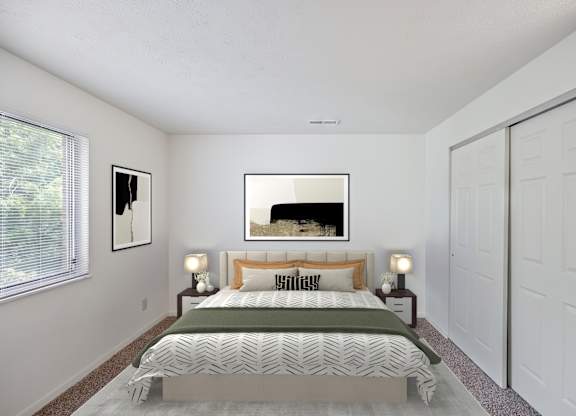A bedroom with a large bed and a painting on the wall.