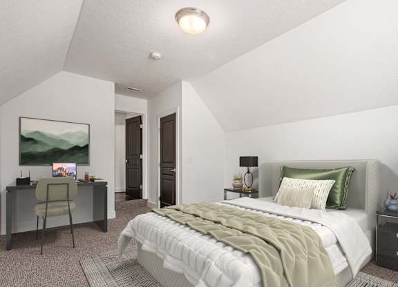 A bedroom with a large bed and a desk with a chair. at River View at Bexley Apartments, River View at Bexley, Ohio