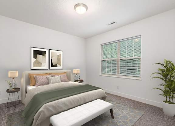 A bedroom with a bed, a bench, and a potted plant. at River View at Bexley Apartments, Ohio, 43209