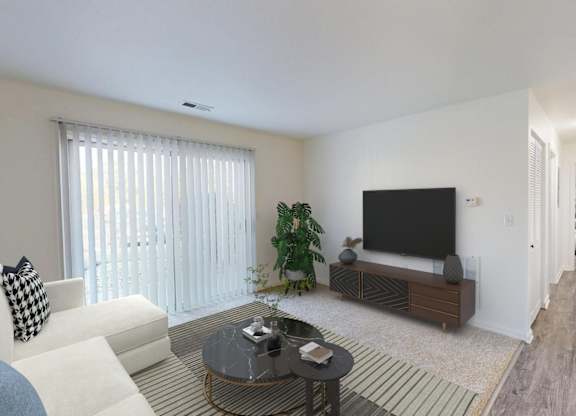 A living room with a white couch and a black television.