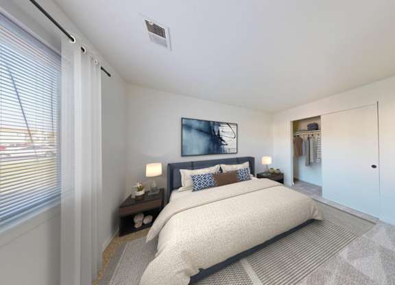 A bedroom with a large bed and a painting on the wall.