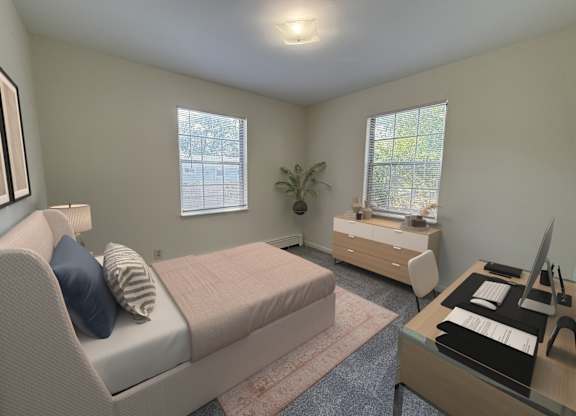 A bedroom with a bed, desk, and chair.