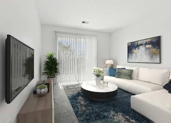 A modern living room with a white couch, a coffee table, and a painting on the wall.