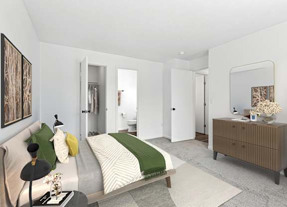 A bedroom with a bed, nightstand, and a plant.