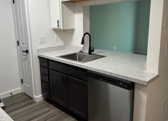 Kitchen with a sink and white cabinets  at Hilltop Apartments, Ohio