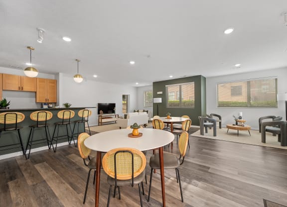 the reserve at bucklin hill clubhouse resident lounge with tables and chairs at DeSales Flats Apartments*, Cincinnati, Ohio