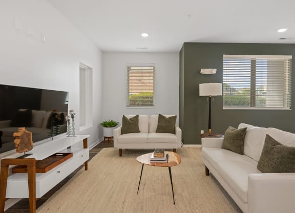 a living room with two white couches and a coffee table at DeSales Flats Apartments*, Cincinnati, 45206