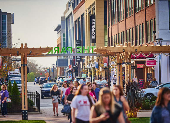 people walking down a busy street in a city