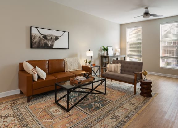 a living room with couches and a table at Adelphi Quarter, Columbus, OH
