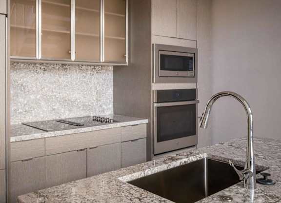 A modern kitchen with a sink and a microwave.at Sky Central, Cincinnati, OH 45202