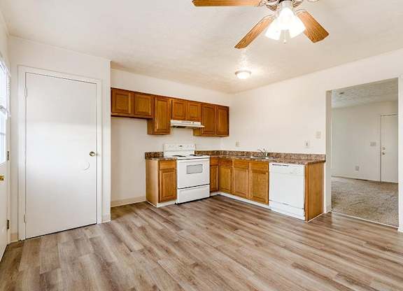 Kitchen with White Appliances at Sharon Green Townhomes, Columbus