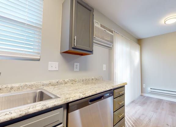 an empty kitchen with a sink and dishwasher and a window at Ridgeview, Fortville, IN 46040