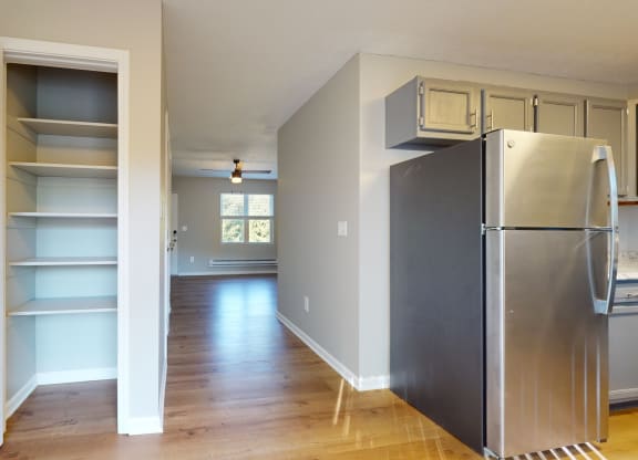 a renovated kitchen with a stainless steel refrigerator and shelves at Ridgeview, Indiana, 46040