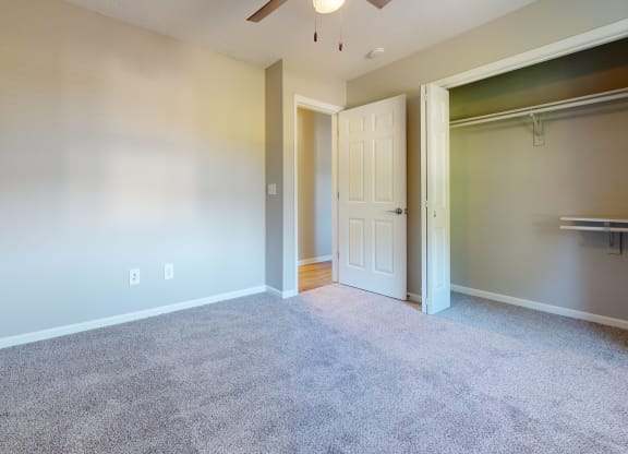 an empty room with a closet and a door to a closet at Ridgeview, Fortville, IN 46040