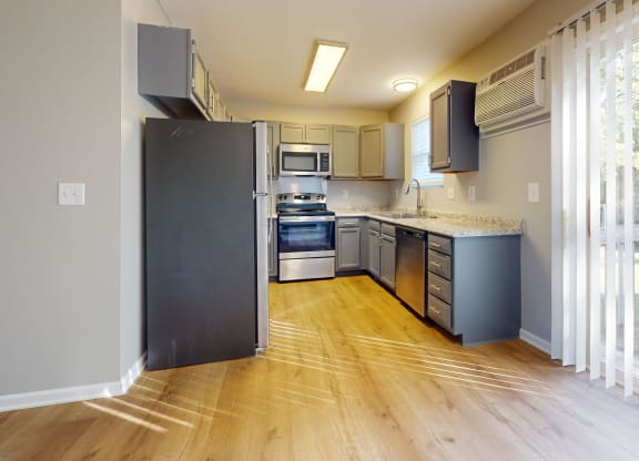 a kitchen with stainless steel appliances and a large window at Ridgeview, Fortville