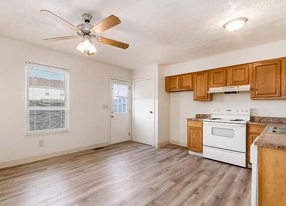 Kitchen with a White Stove at Sharon Green Townhomes, Ohio