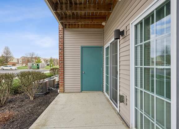 A building with a blue door and a glass window.