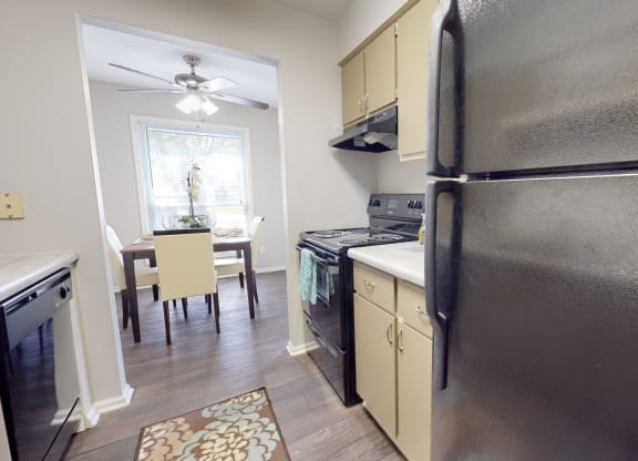 Kitchen and dining area in a 555 waverly unitat Summit at Keystone, Indiana, 46220