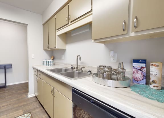 Kitchen with beige cabinets and stainless steel appliancesat Summit at Keystone, Indianapolis, IN 46220