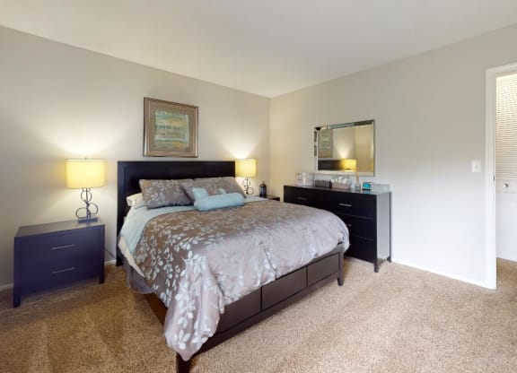 Bedroom with a bed and two night stands at Summit at Keystone, Indianapolis, 46220