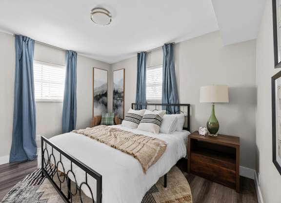 Bedroom with a large bed at The Rand Apartments, Columbus, OH