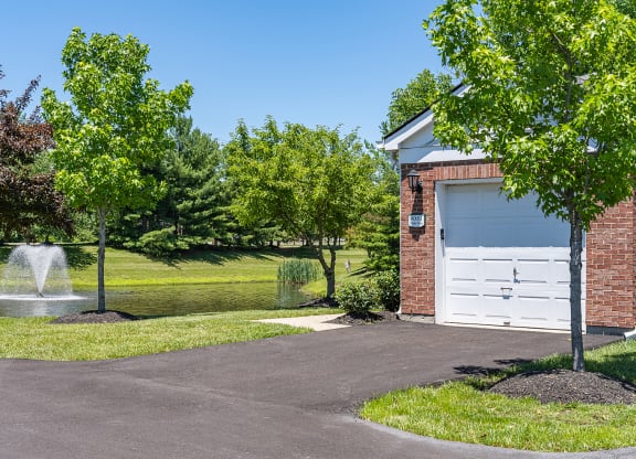 a driveway with a fountain and a garage door at Bishops Gate, Cincinnati, 45249
