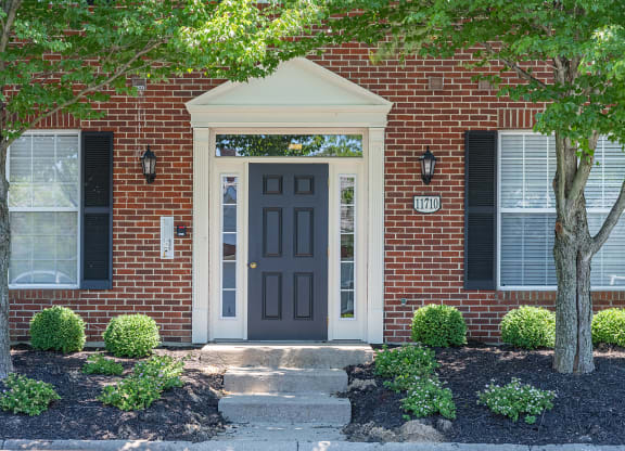 a red brick house with a black door at Bishops Gate, Cincinnati, 45249